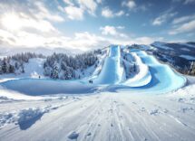 Atleti in azione durante una gara di snowboard cross